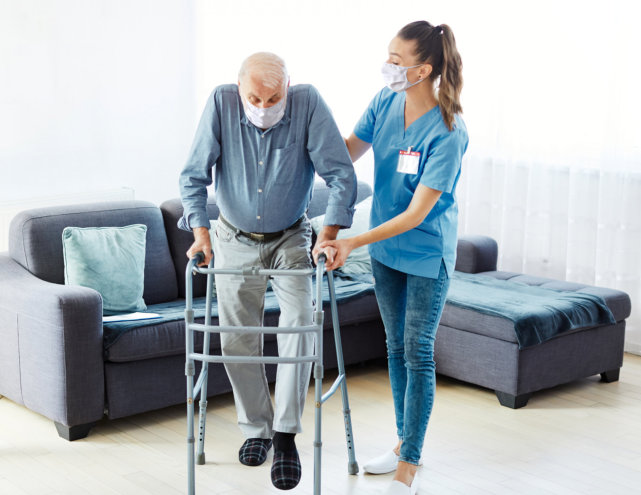 image of an elderly man with a female caregiver