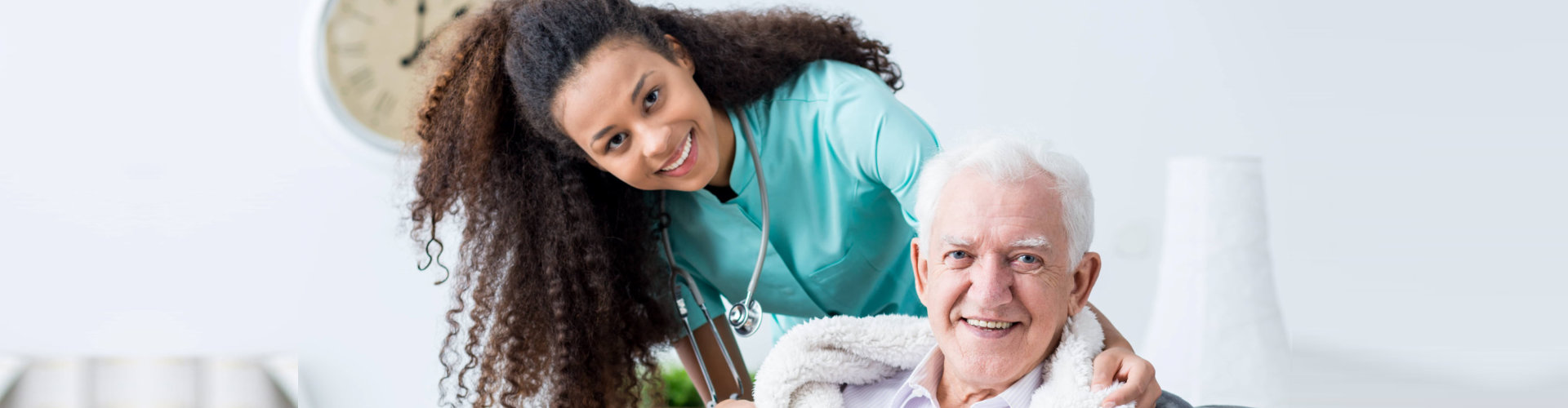 a female nurse with an elderly man